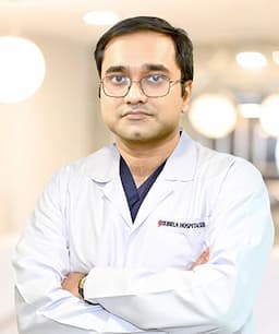 Dr. Manish De